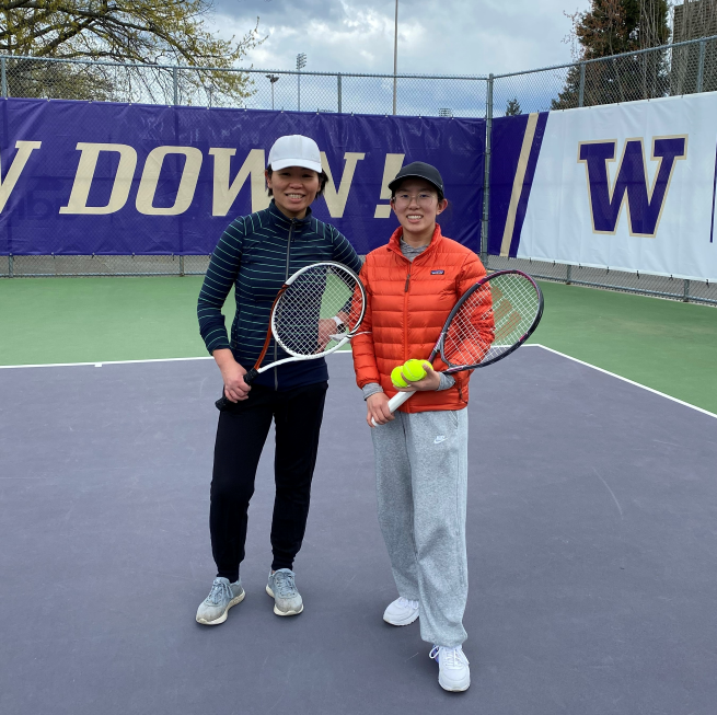 Jieyu-Zhou playing tennis with colleague