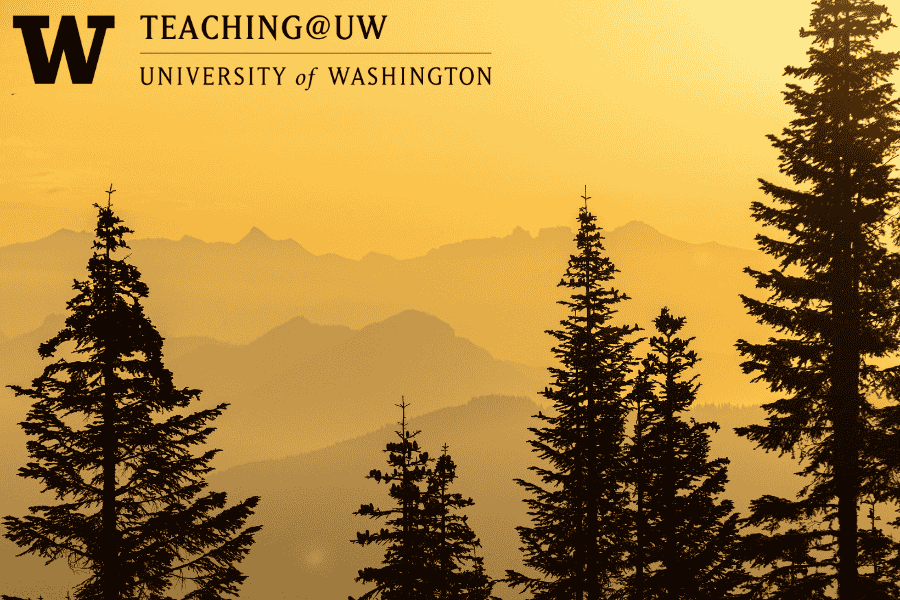 Golden sunrise with mountains in the background and trees in the foreground