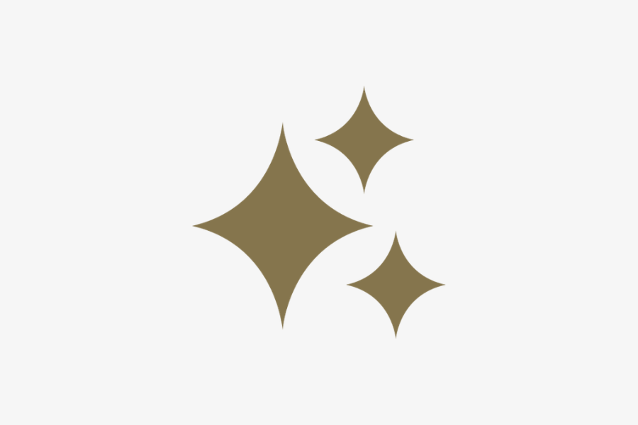 gold AI logo that has three sparkles with a white background